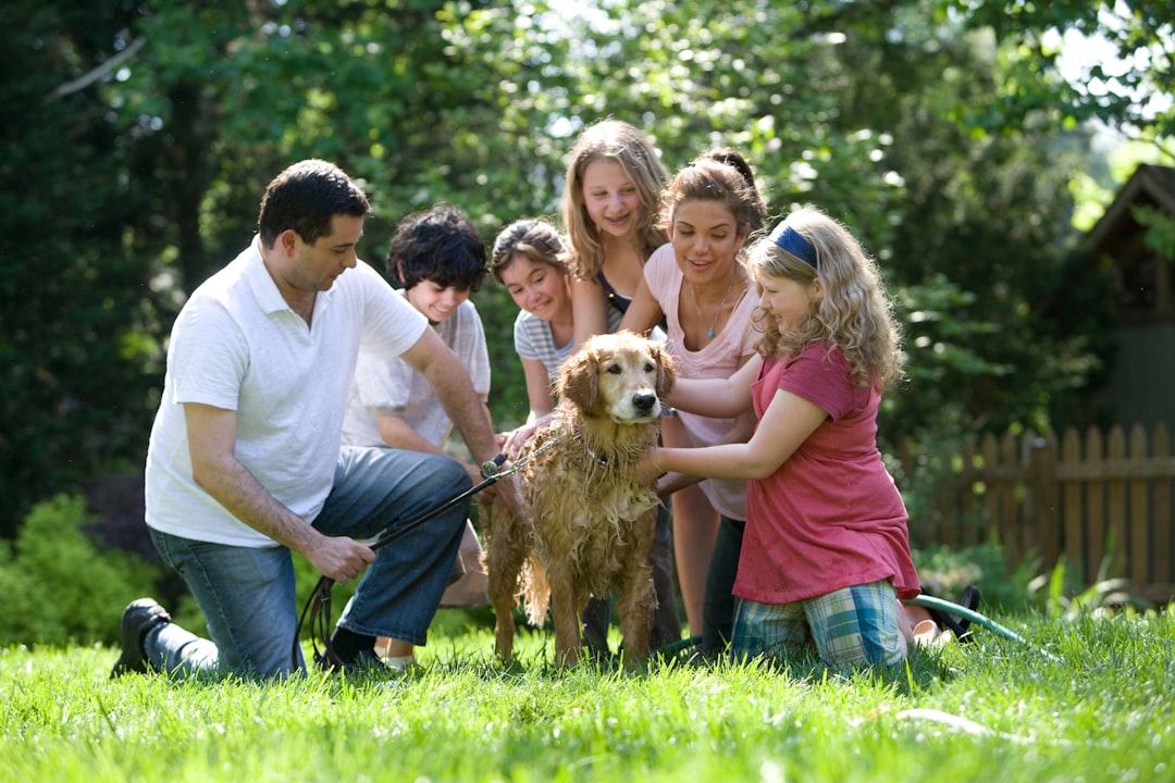 A happy family welcoming a new dog into their home, showcasing love and excitement.